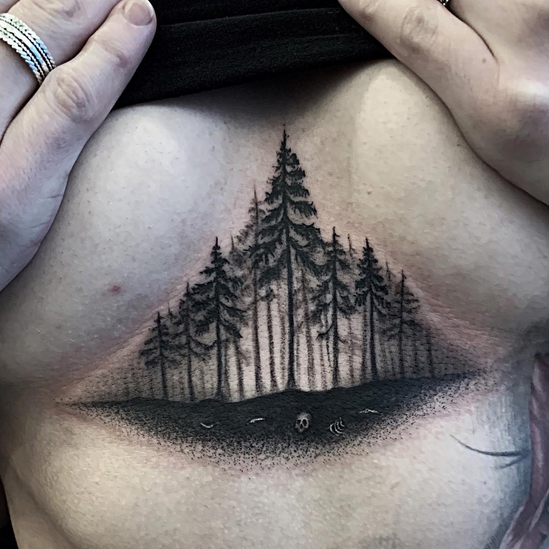 Forest and bones black and grey tattoo middle of chest triangle done by Alan Lott. Book your next custom tattoo at Sacred Mandala Studio- Custom Tattoo and Art Gallery for the Triangle of North Carolina- Raleigh, Durham and Chapel Hill